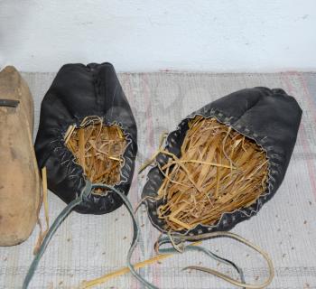 Leather sandals stuffed with hay to maintain the shape.