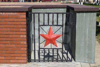 Red five-pointed star that adorns the steel gate. The steel door in an underground room under the monument.