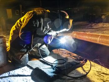 Safety at work. Welding and grinding of iron constructions. Industrial weekdays welders and fitters.