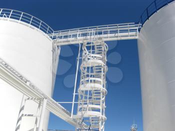 The tank with water and a ladder. Equipment for primary oil refining.