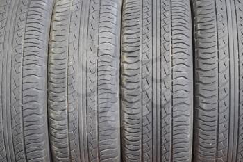 The background of the tread pattern of the car wheel. Rubber tires.