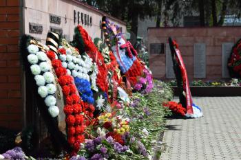 VILLAGE POLTAVA. 9 May, 2015: The laid flowers to a monument in honor of a Victory Day on May 9. Patriotic traditions.