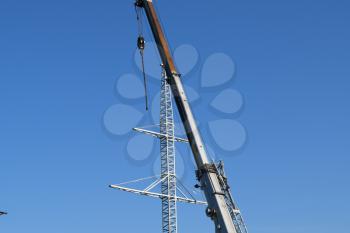 The elevator crane on a truck platform.