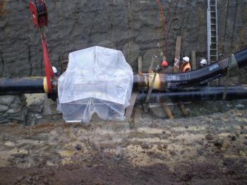 Sakhalin, Russia - 12 November 2014: Laying of the gas pipeline in a ditch. Installation works.