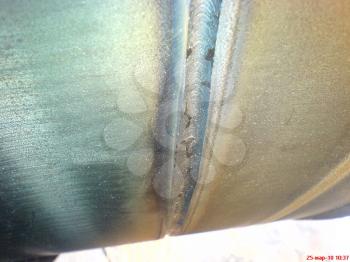 Welded seam on the pipeline. Compound of metal.