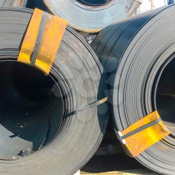Steel sheets rolled up into rolls. Export Steel. Packing of steel for transportation.