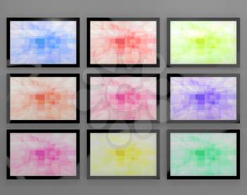TV Monitors Wall Mounted In Different Colors Representing High Definition Televisions Or HDTV