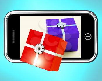 Gift Boxes Coming From Mobile Phone Showing Buying Presents Online
