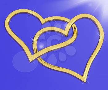 Gold Heart Shaped Rings On Blue Representing Loving And Romance