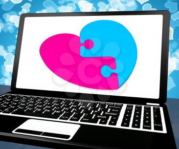 Puzzle Heart On Laptop Showing Online Dating And Romance