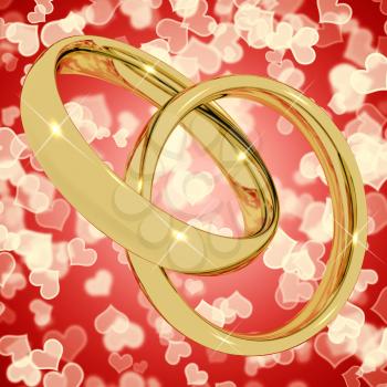 Gold Rings On Heart Bokeh Background Represents Love Valentine And Romance