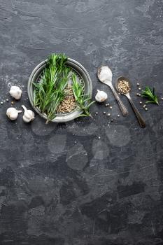 Rosemary, garlic, salt and white pepper, culinary background with various spices, directly above, flat lay, copy space