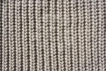 Close up detail of knitted beige wool