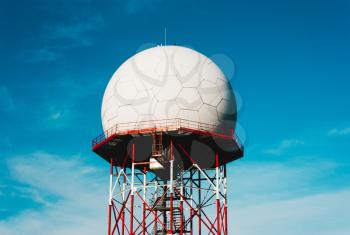 Telecommunication tower unusual shape against the blue sky , Telecom celullar mobile ,cell antenna, transmitter.