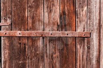 Old antique  wooden groung the background with rusty iron nails and a staple,rustic wall or table