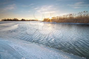 Winter landscape and icy river. Nature composition.