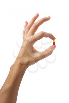 Hand with pill. Element of medical design.