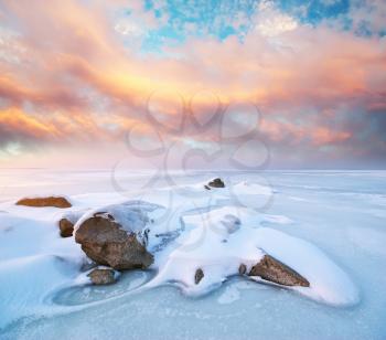 Stone on ice. Winter landscape. 