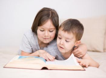 Happy children is reading book