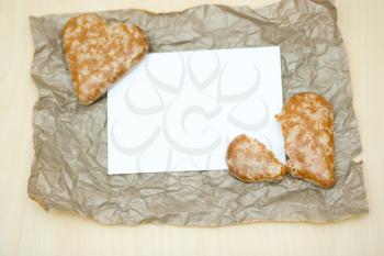 gingerbread cookies in the form of heart on a paper background