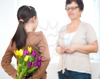 Portrait of happy grandmother with granddaughter. Spring family holiday concept. Mother's day
