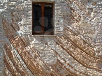details of architecture, historical buildings of Italy. Stone walls and stone mask.