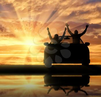 Travel and freedom. Happy people in the car meet the sunset and their reflection in the river