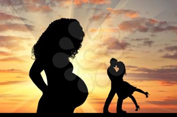 Concept of betrayal. Silhouette of a lone pregnant woman against the sunset and loving couple