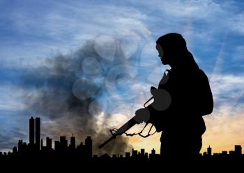 concept of terrorism. Silhouette terrorist on city background in smoke