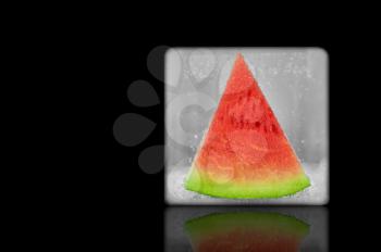Frozen slice of watermelon. Isolated on a black background. design element