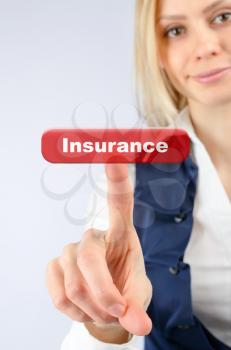 Insurance concept. Business woman presses the button insurance