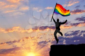 ?oncept of gay people. Silhouette of a happy gay jump on top
