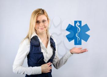 Concept of health and medicine. Business woman holding a health icon