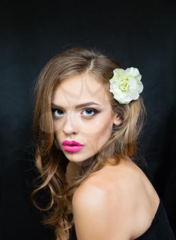 The portrait of a girl with pink lips flower head