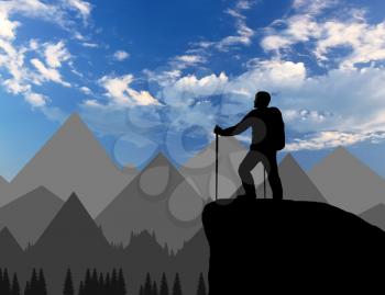 Silhouette of a climber on top looks into the distance over the mountains. Concept effort
