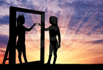 Silhouette of a narcissistic woman with a crown on her head and a hand gesture of the heart in reflection in the mirror. The concept of narcissism and selfishness