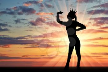 A silhouette of a narcissistic woman with a crown on her head shows her finger on herself. She drew attention to themselves. The concept of narcissism and selfishness