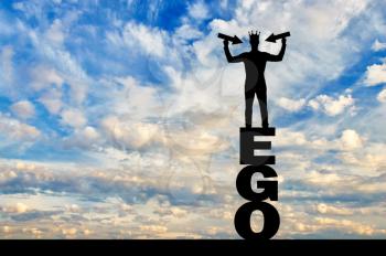 Silhouette of a narcissistic man with a crown on his head showing arrows pointing at himself standing on the word ego. He tries to attract attention. The concept of narcissism and selfishness