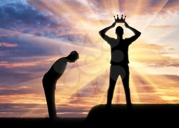 Concept of selfishness and narcissistic. Silhouette of a man dresses his crown, and a servant bows to him