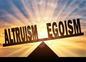 Altruism concept. Word altruism is in priority over the word egoism on the scales on a sunset background.