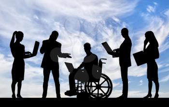 Silhouette of a disabled man in a wheelchair and his work team during a work process. Disabled working concept