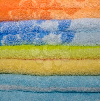 Background with bright pure colored Terry towels.