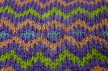Bright background with zigzag knit multicolored stripes.