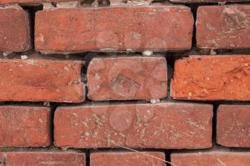 Old brickwork with the mark on each brick.