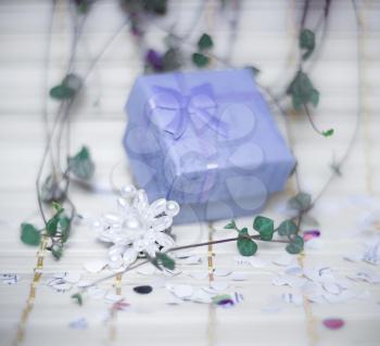 Open gift box. Shallow depth of field. Focus on the decoration of beads.