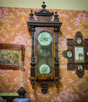 City Udomlya, Russia - December 27, 2013: Antique clock. Fragment of the exposition of court life in the 19th century museum. Russia.