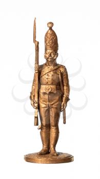 Gold tin soldier, isolated on white background.