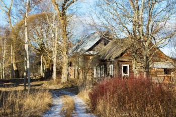 Sunny winter landscape with abandoned houses in the village of Palcevo.. Russia, Tver region, Bologovsky District.