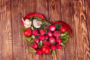 Heart symbol. diet concept. Healthy eating concept / food photography of heart made from different vegetables on wooden table 