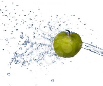 Green apple slices with water splash